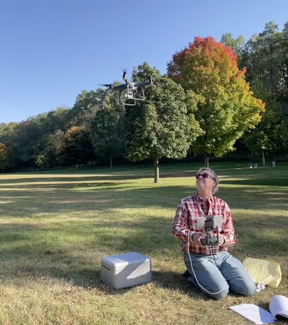 Thomas Wassmer, Professor of Biology and grant project leader flying a drone.
