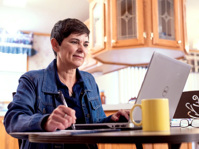 Adult woman at computer.