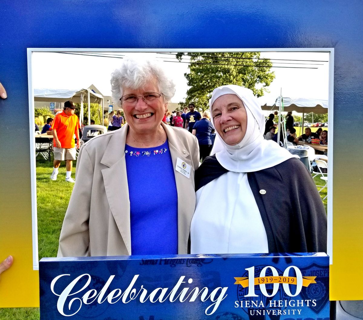 Sister Sharon poses with Sister Mary Poor at the Centennial Mall Dedication for SHU's 100th anniversary.