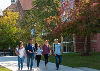 students walking on sidewalk