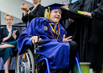 SHU student in wheelchair at commencement.